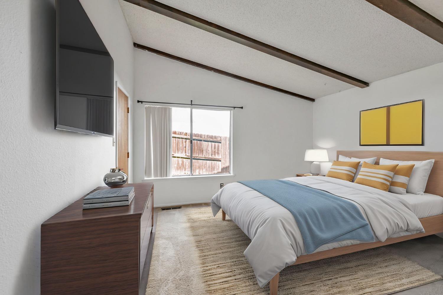 7822 Tamara Drive Fair Oaks, CA 95628 - Photo 27 of 28 a bedroom with a bed and a flat screen tv