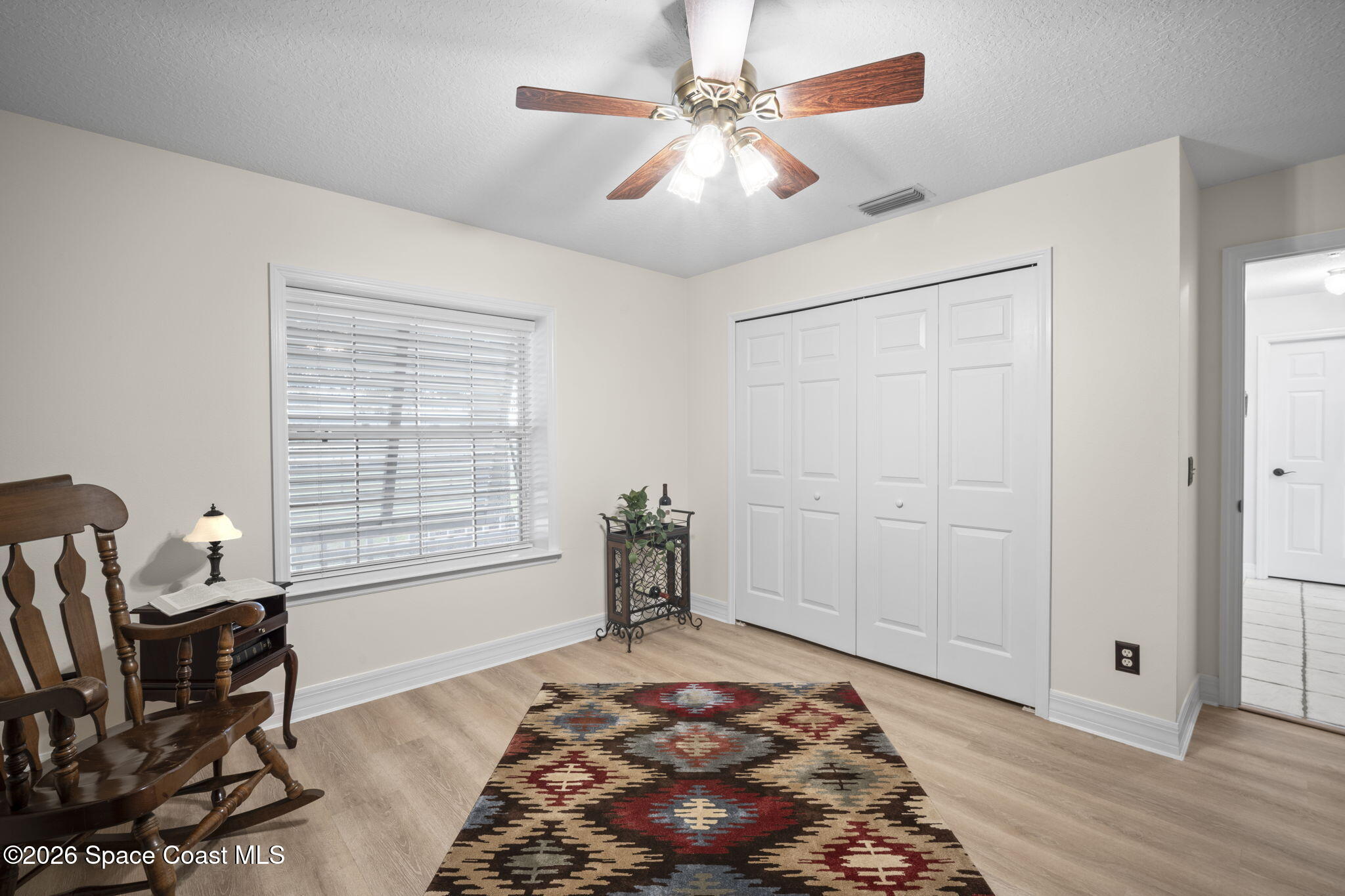3125 Davis Road Mims, FL 32754 - Photo 24 of 47 a bedroom with a bed and wooden floor