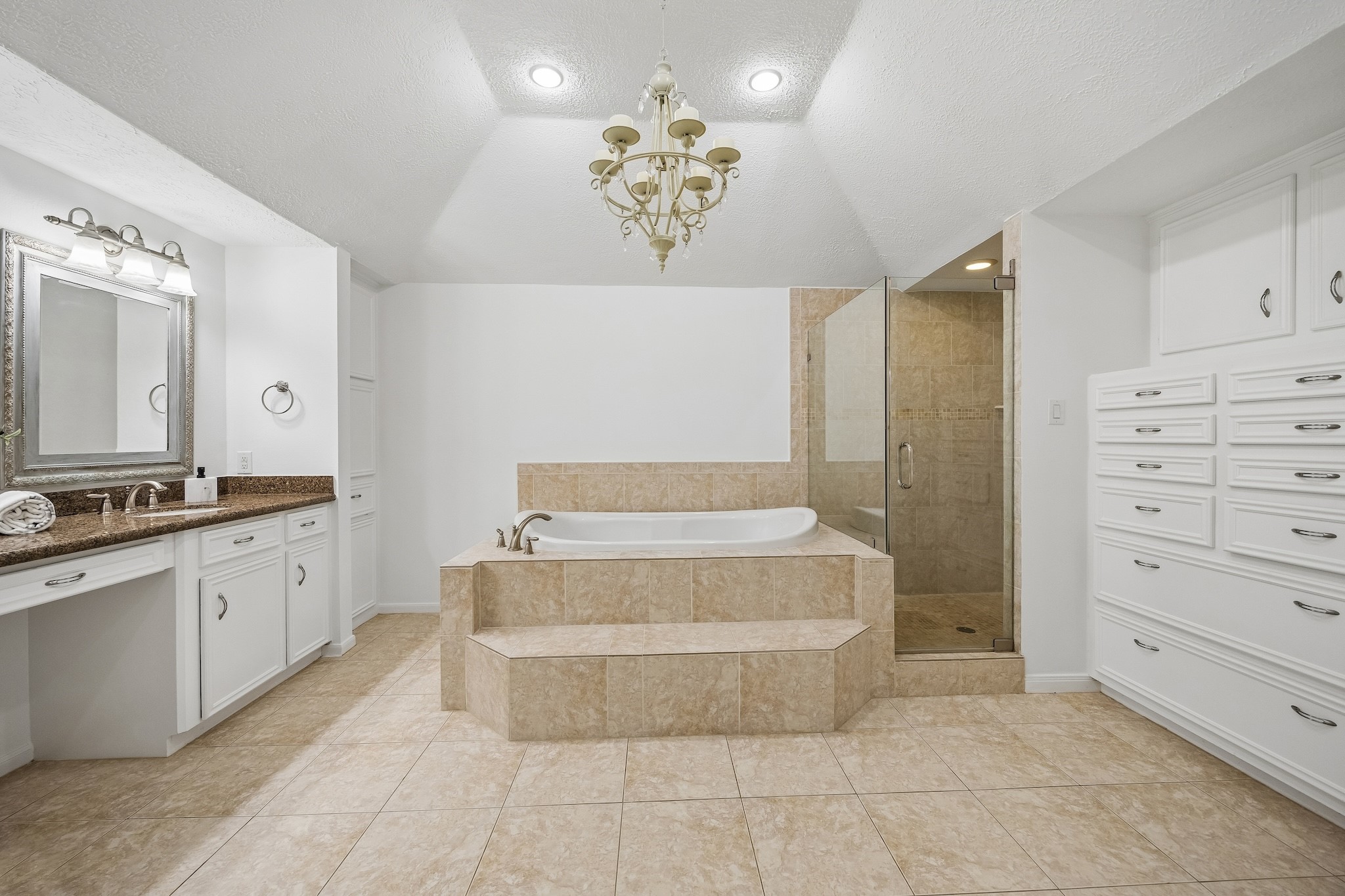 9718 Oxted Lane Spring, TX 77379 - Photo 15 of 38 The spa-like bathroom features a double vanity, large tub and separate Euroglass shower