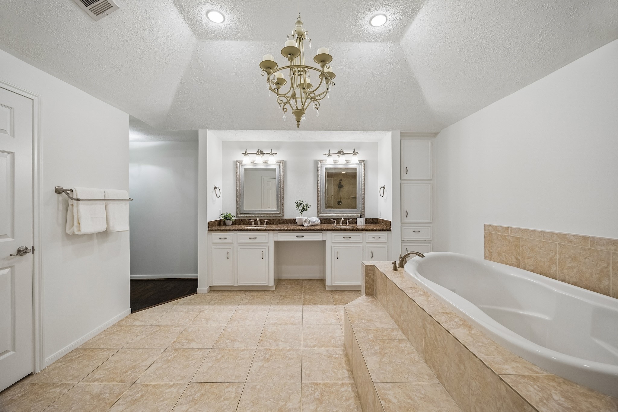 9718 Oxted Lane Spring, TX 77379 - Photo 17 of 38 Recessed LED lights provide soft white lighting along with the statement chandelier