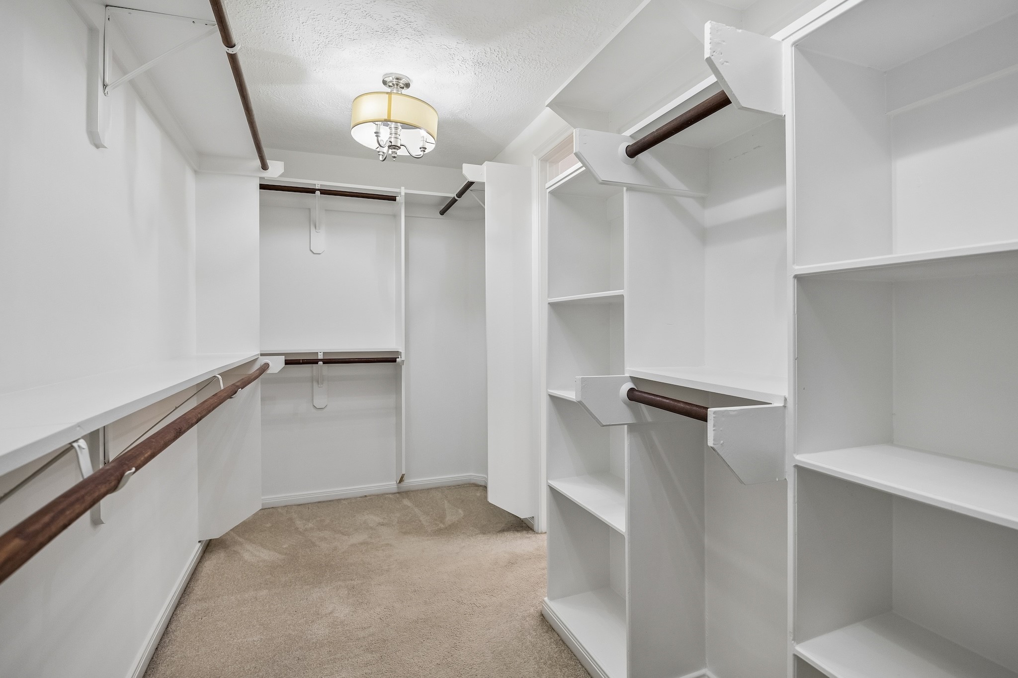 9718 Oxted Lane Spring, TX 77379 - Photo 18 of 38 Always a plus to have a large walk-in closet with built-in shelving as well as double and single hanging bars