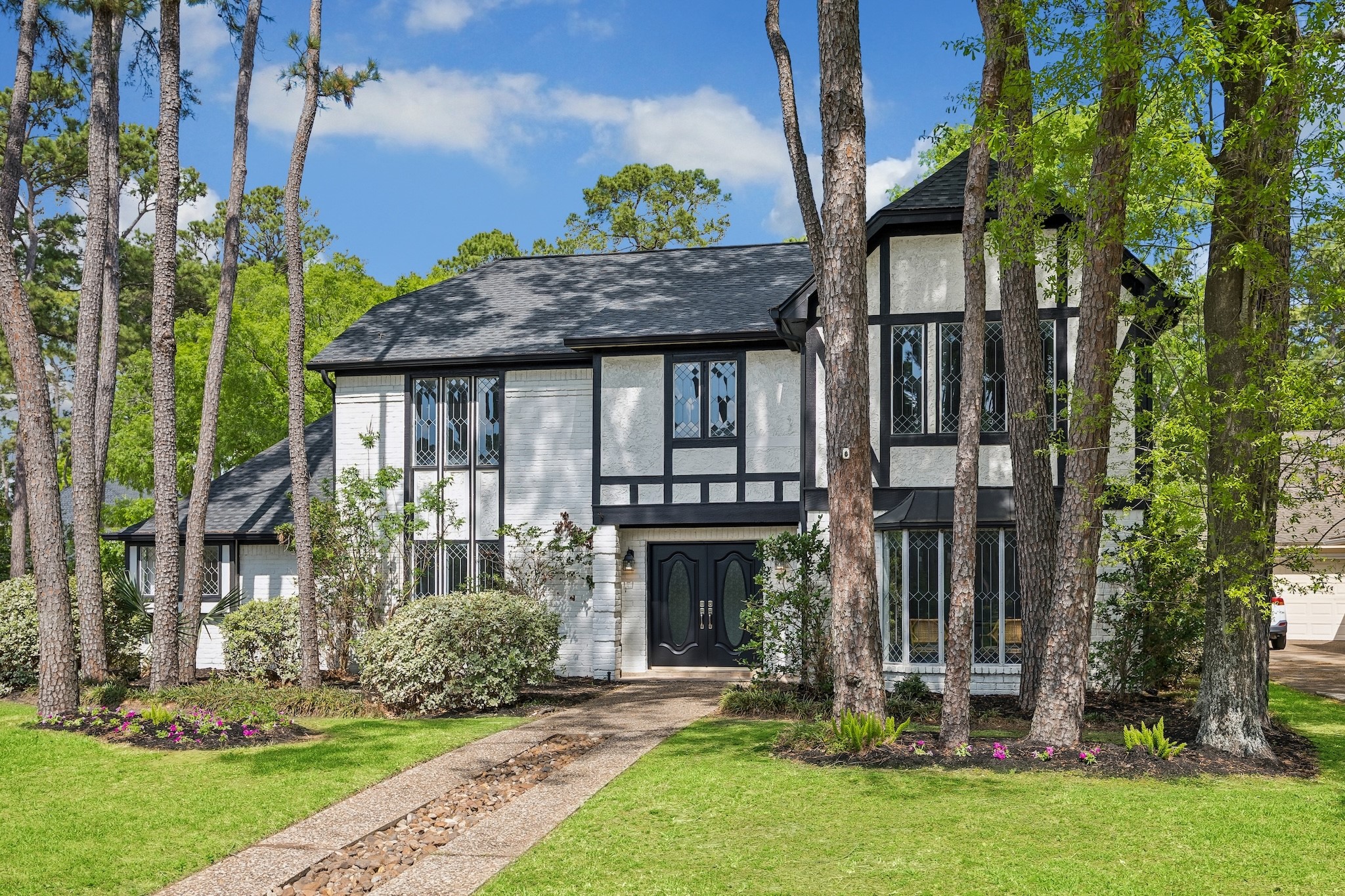 9718 Oxted Lane Spring, TX 77379 - Photo 2 of 38 Situated on a prime corner lot with four-bedrooms, three-full baths and two half-baths it is move in ready