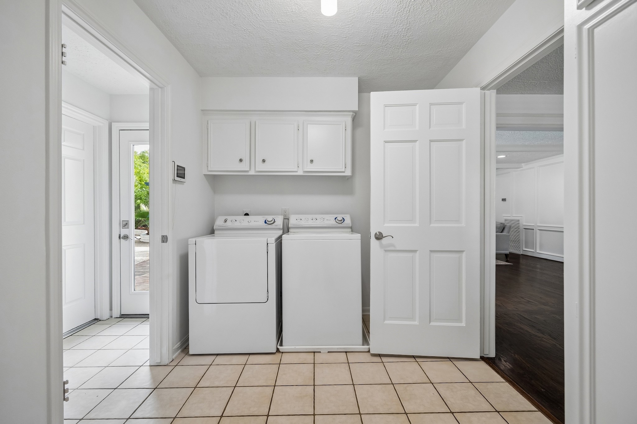 9718 Oxted Lane Spring, TX 77379 - Photo 22 of 38 The first floor also has a clean utility room outfitted with cabinets and not pictured is the efficient second half bath
