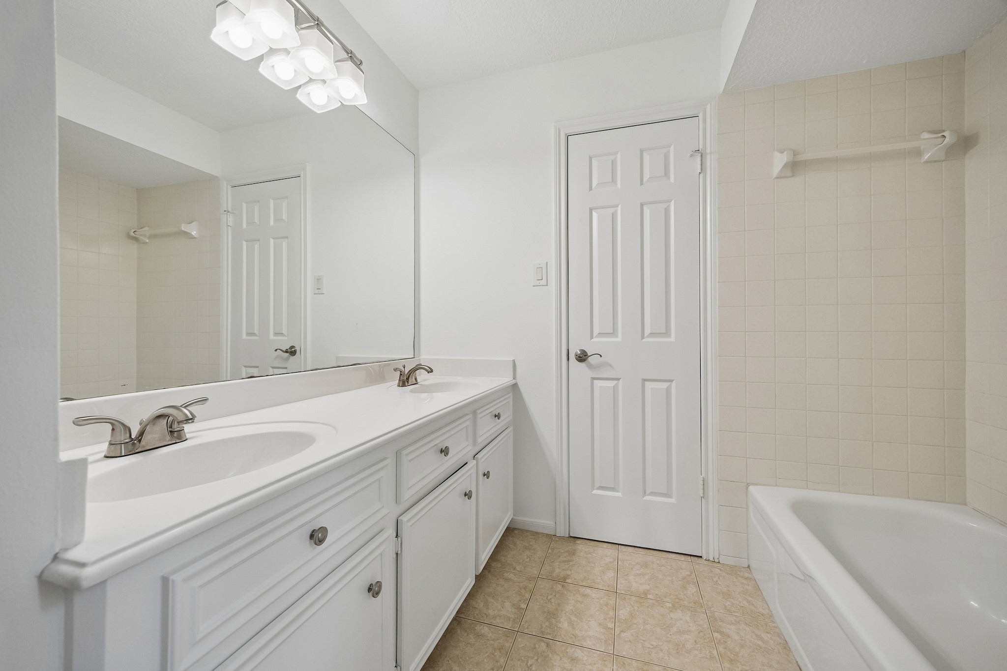 9718 Oxted Lane Spring, TX 77379 - Photo 27 of 38 Two of the bedrooms share a meticulously kept Hollywood bath