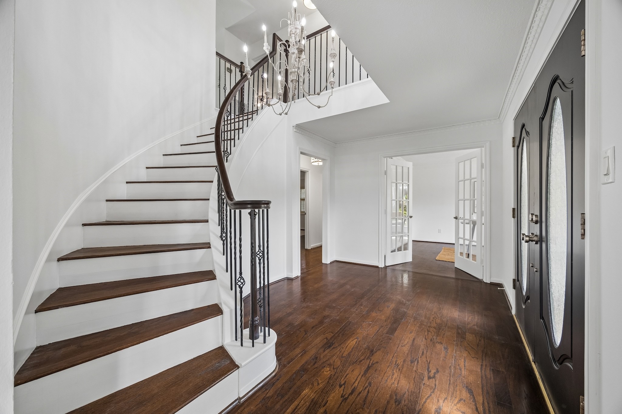 9718 Oxted Lane Spring, TX 77379 - Photo 4 of 38 Enter to a airy foyer with sweeping spiral staircase