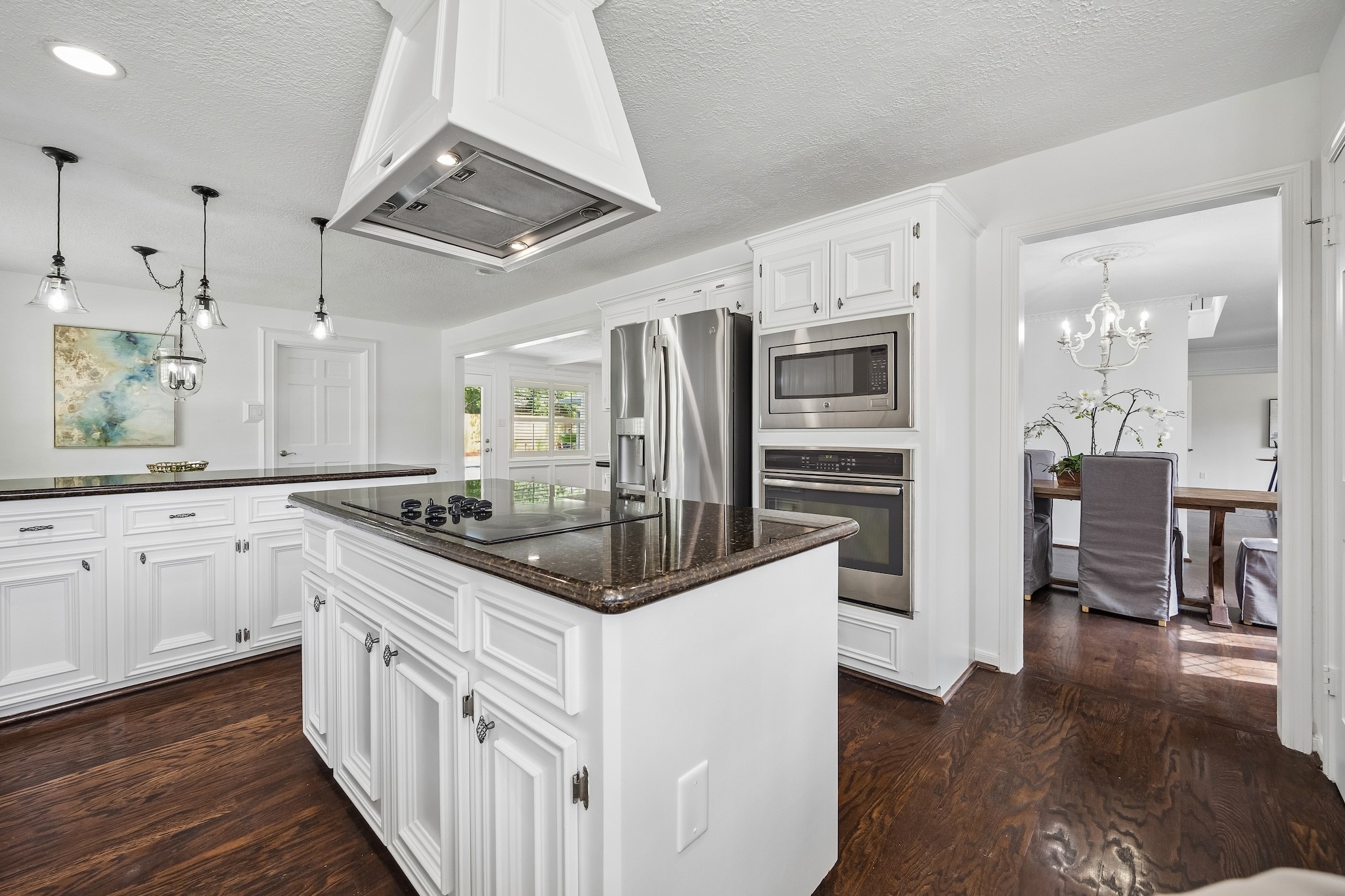 9718 Oxted Lane Spring, TX 77379 - Photo 9 of 38 There are designer pendant lights and a custom vent hood