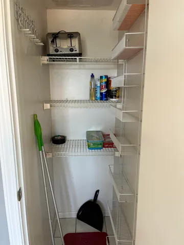 a kitchen with kitchen island granite countertop a sink stainless steel appliances and cabinets