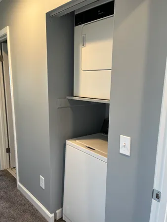 a bathroom with a shower and toilet