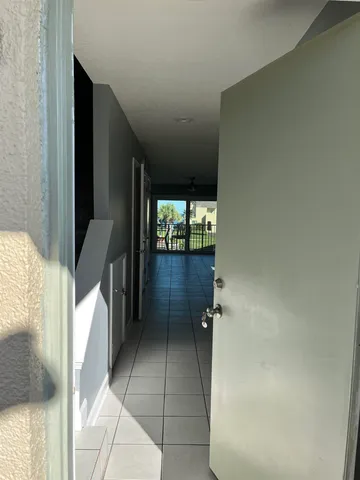 a kitchen with a sink cabinets and a window