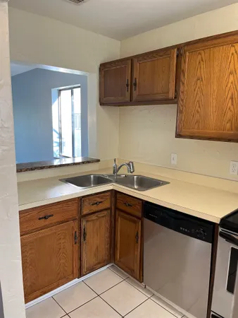 a view of a kitchen with a sink and a microwave