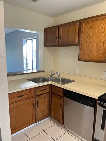 a view of a kitchen with a sink and a microwave