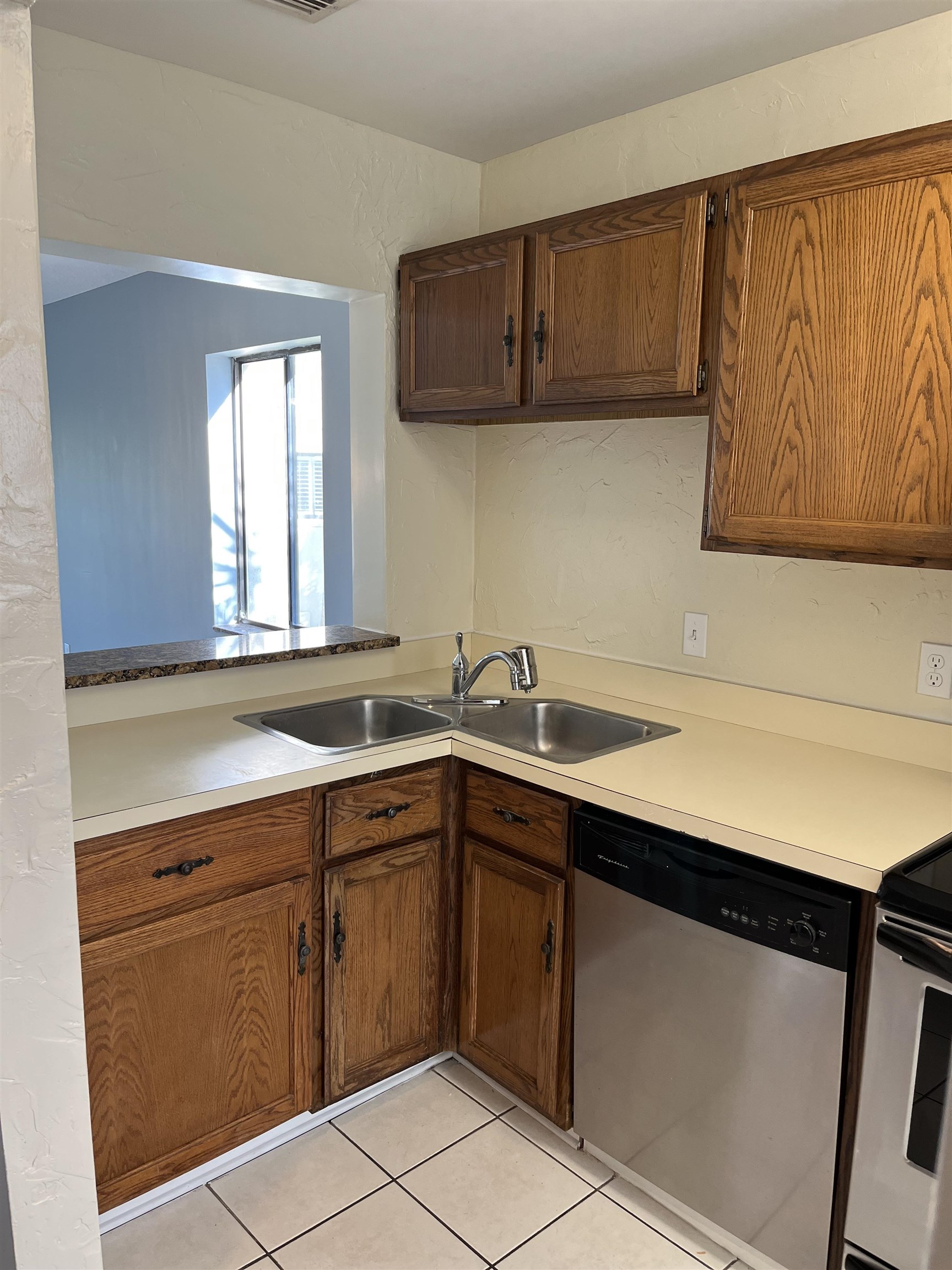 8550 A1A South, Unit 336 St. Augustine, FL 32080 - Photo 8 of 37 a kitchen with a sink cabinets and a window