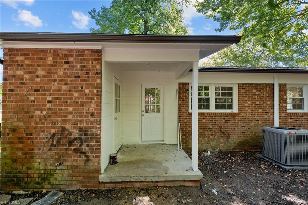 403 Snider Street High Point, NC 27265 - Photo 17 of 23 Covered rear patio, with storage room that contains laundry hookups.