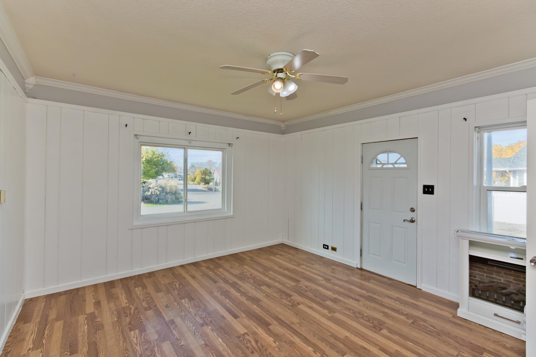 431 Pleasant Ridge Lane, Unit B Grand Junction, CO 81507 - Photo 11 of 20 a view of an empty room with wooden floor and a window