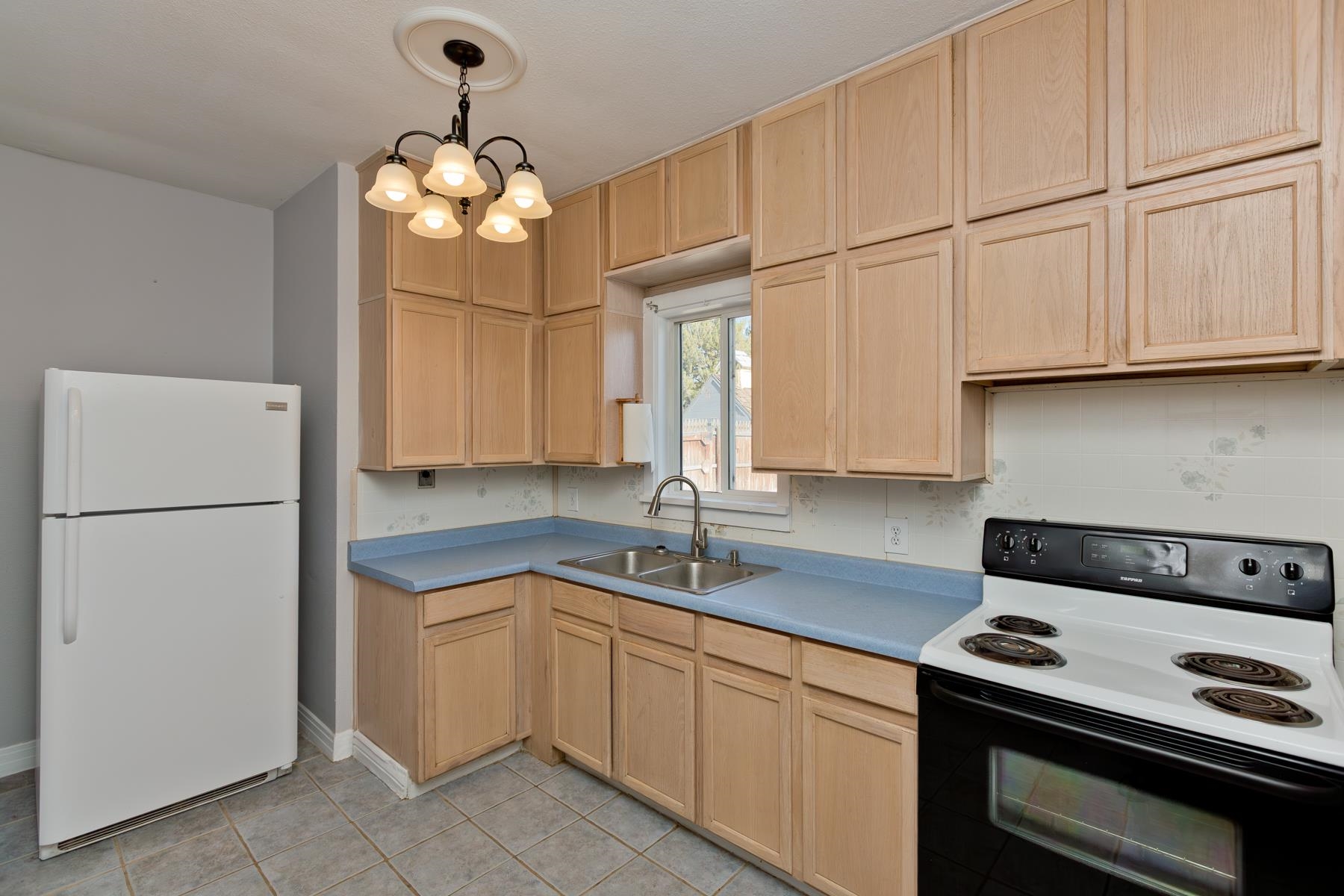 431 Pleasant Ridge Lane, Unit B Grand Junction, CO 81507 - Photo 15 of 20 a kitchen with cabinets appliances and a sink