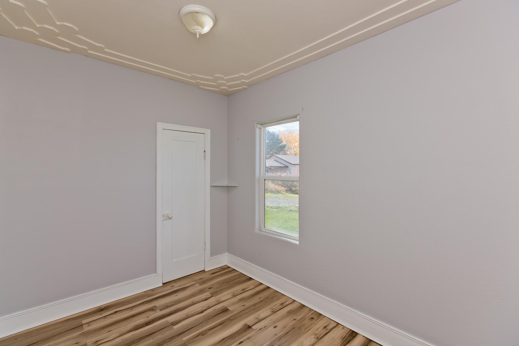 431 Pleasant Ridge Lane, Unit B Grand Junction, CO 81507 - Photo 18 of 20 a view of an empty room with window and closet area