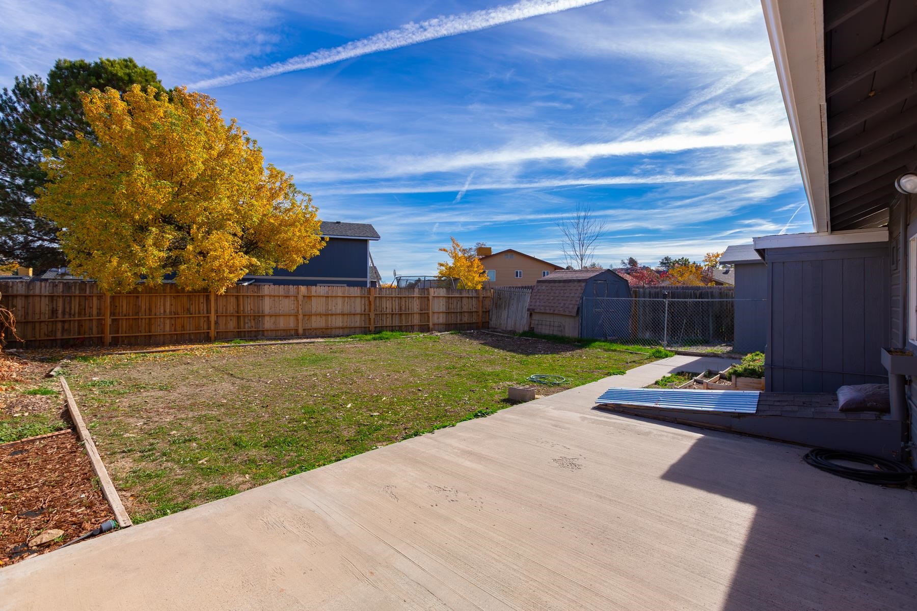 431 Pleasant Ridge Lane, Unit B Grand Junction, CO 81507 - Photo 4 of 20 a view of a backyard with wooden fence