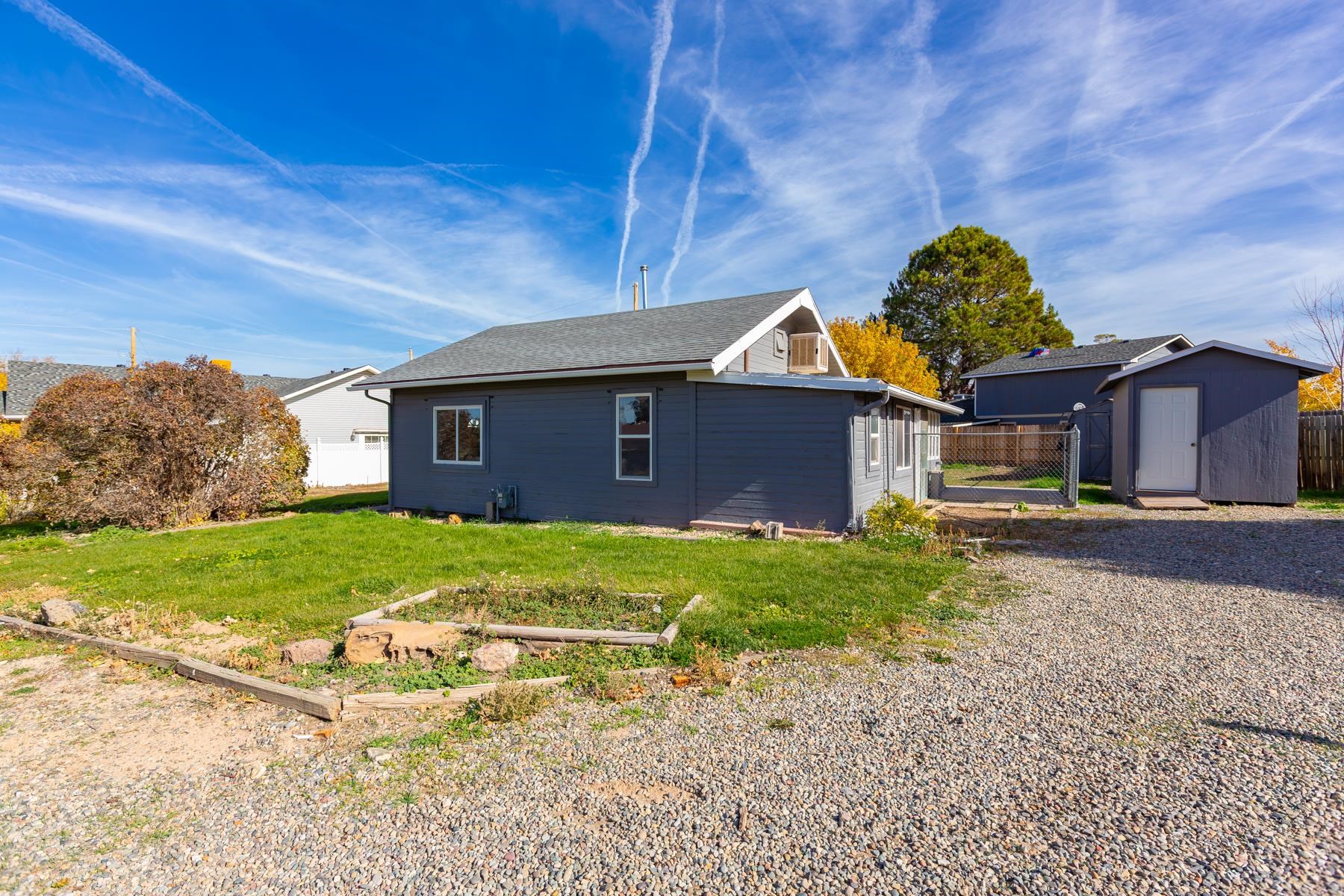 431 Pleasant Ridge Lane, Unit B Grand Junction, CO 81507 - Photo 7 of 20 a front view of a house with a garden