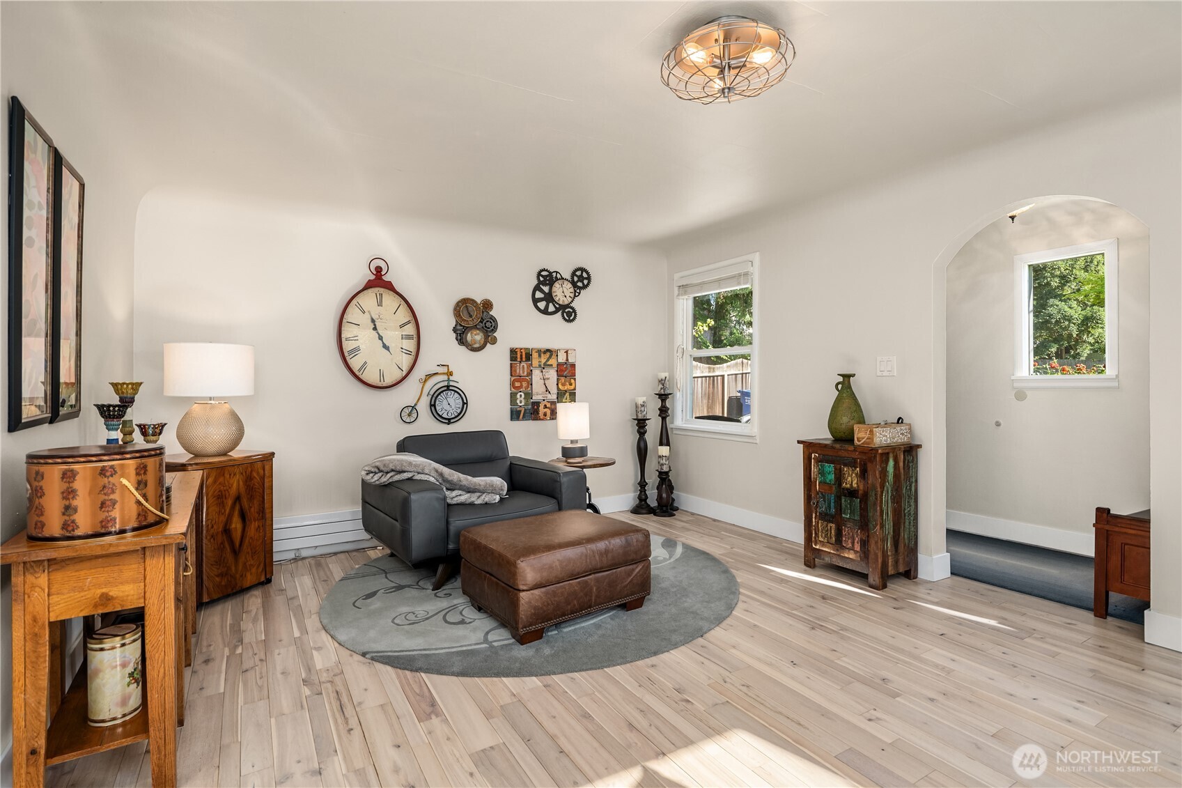 4014 Southwest 98th Street Seattle, WA 98136 - Photo 23 of 36 a living room with furniture and a clock