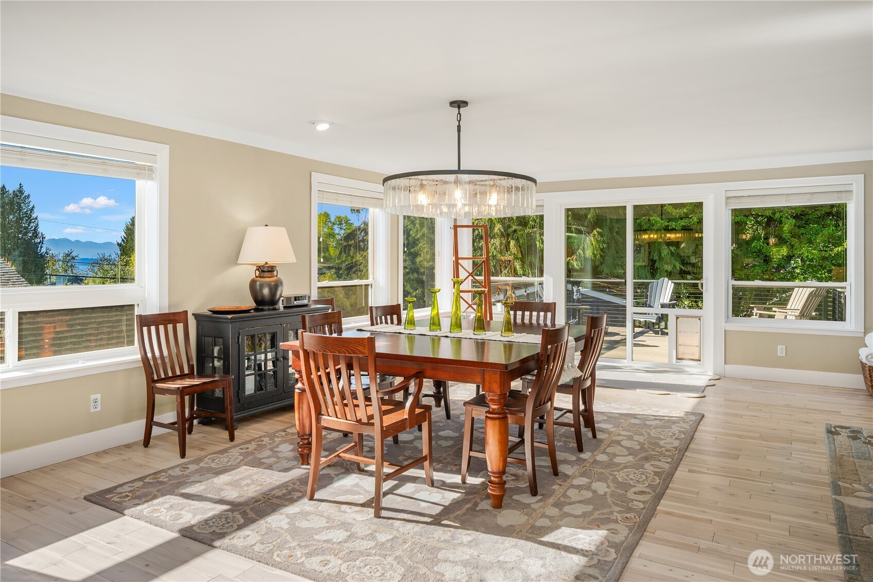 4014 Southwest 98th Street Seattle, WA 98136 - Photo 8 of 36 a dining room with furniture a chandelier and wooden floor