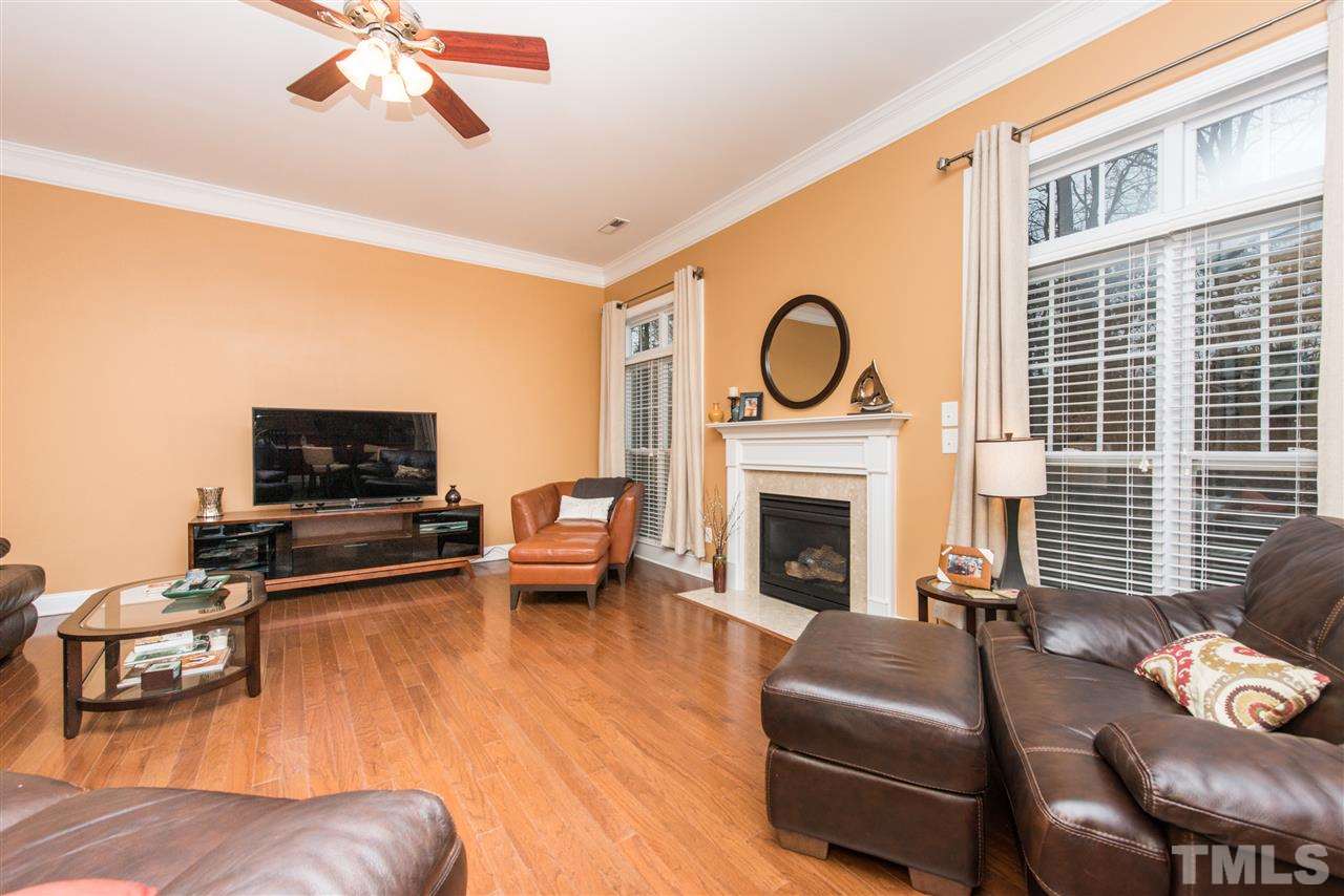 924 Chapanoke Road Raleigh, NC 27603 - Photo 8 of 20 a living room with furniture and a fireplace