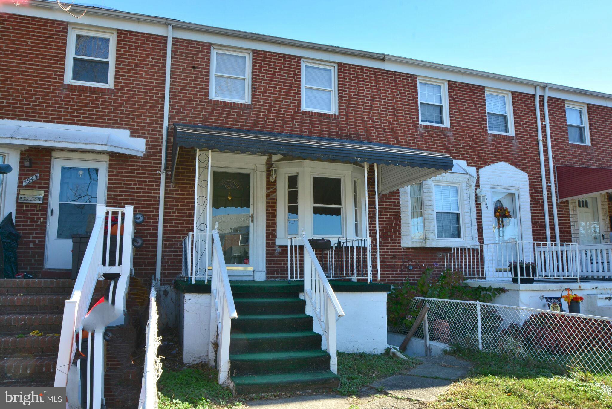 1947 Quentin Road Baltimore, MD 21222 - Photo 2 of 20 a front view of a house with a yard