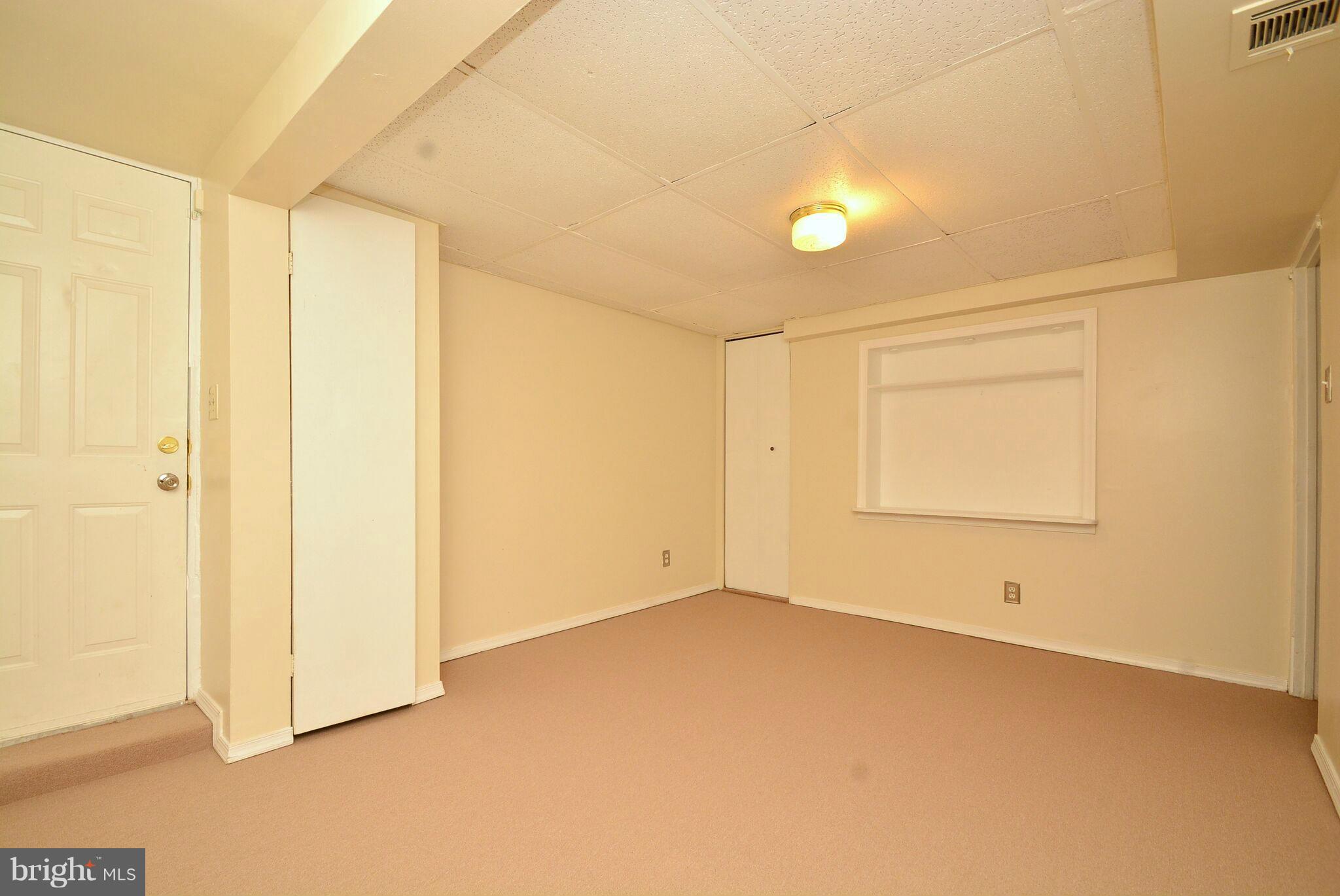 1947 Quentin Road Baltimore, MD 21222 - Photo 15 of 20 a view of an empty room with a window