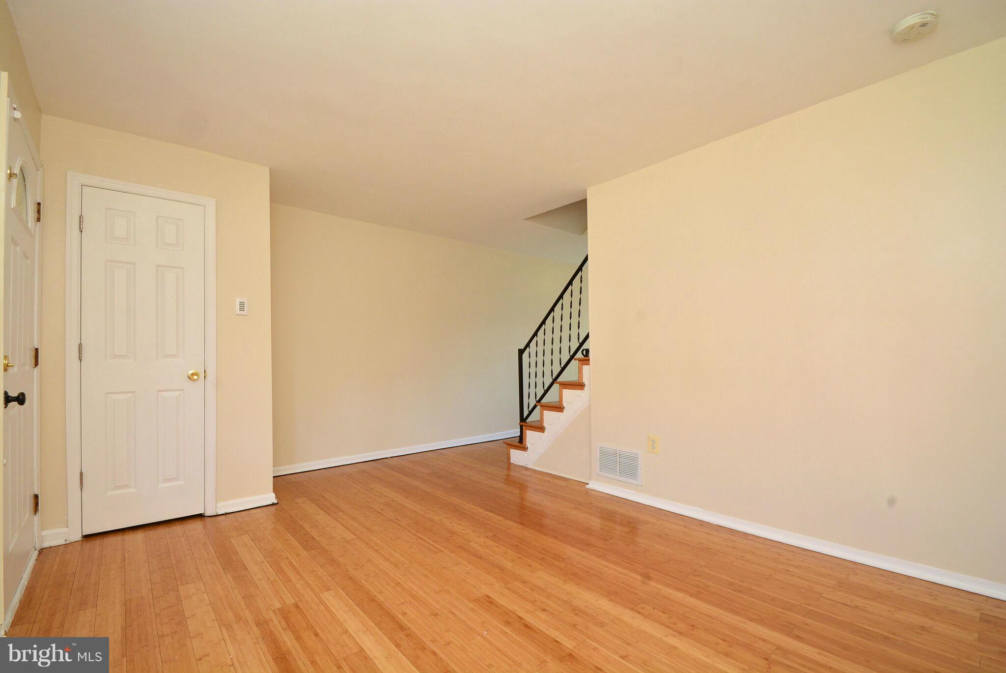1947 Quentin Road Baltimore, MD 21222 - Photo 3 of 20 a view of entryway and hall with wooden floor