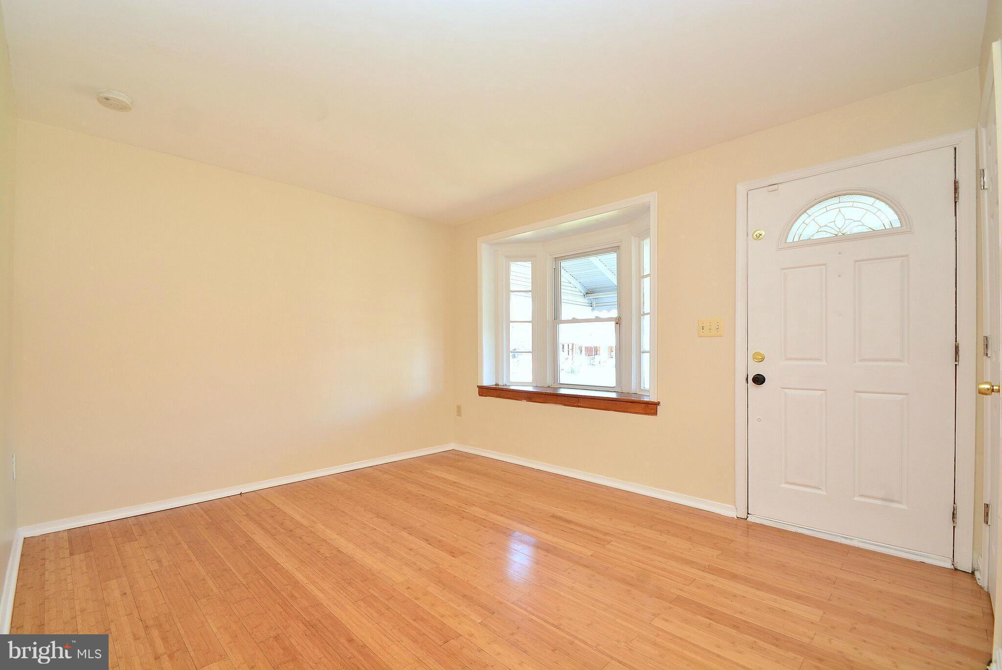 1947 Quentin Road Baltimore, MD 21222 - Photo 5 of 20 an empty room with windows