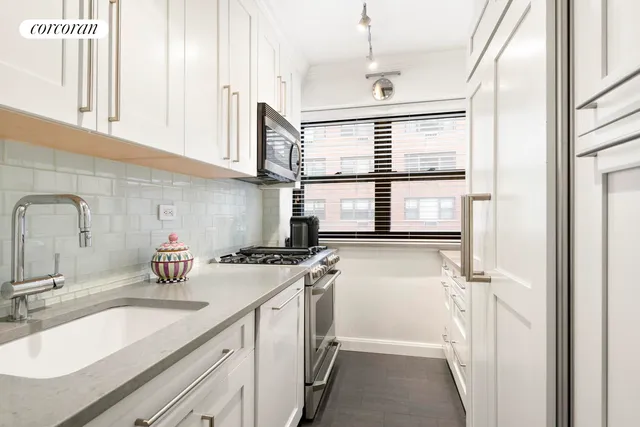 a kitchen with a sink stove and refrigerator