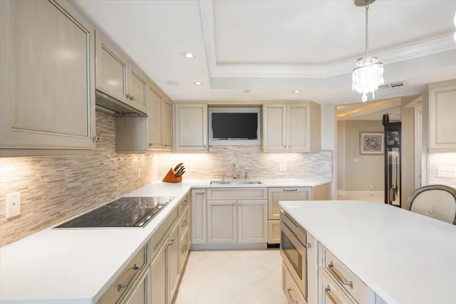 a kitchen with a sink stove and refrigerator