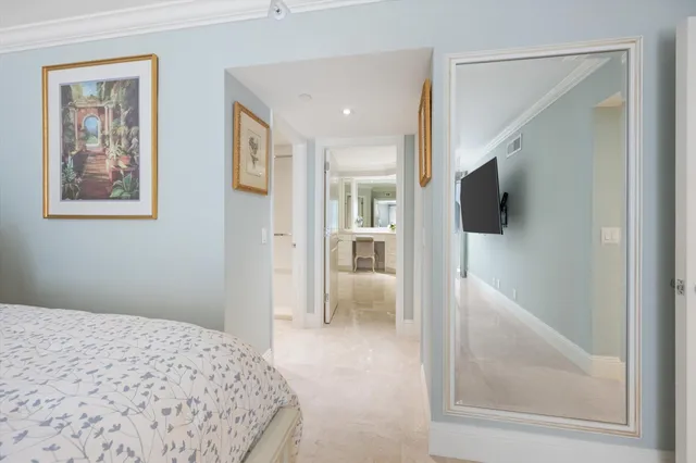 a bedroom with a bed and a view of bathroom