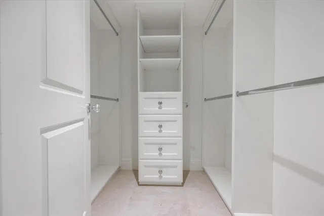 a view of an empty walk in closet
