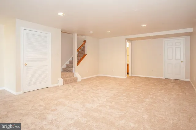 a white toilet sitting next to a bathroom sink