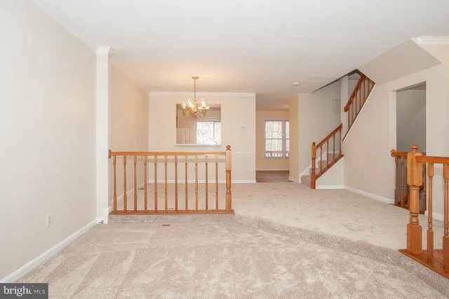 a view of an empty room with stairs