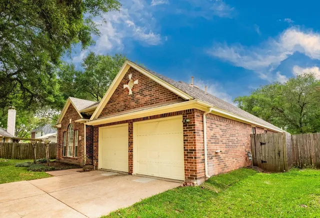a view of backyard with large tree