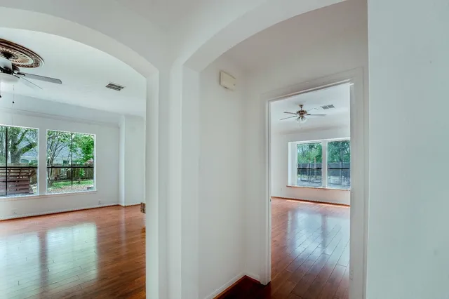 a view of room with window and wooden floor