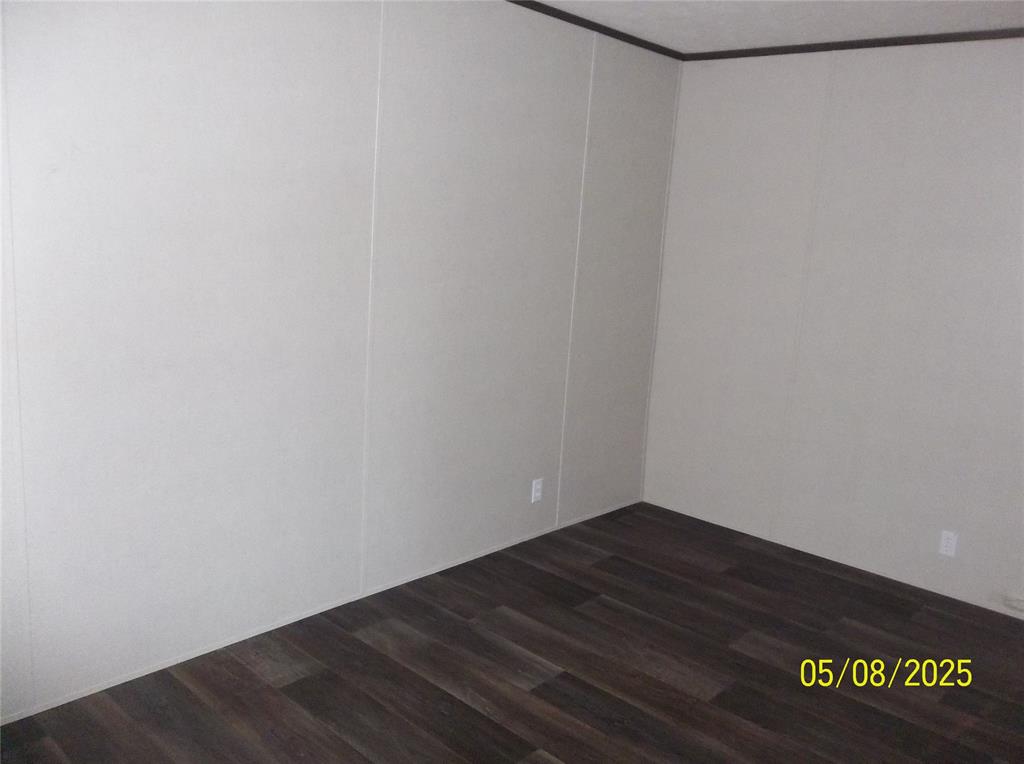 531 Blair Road Waxahachie, TX 75165 - Photo 10 of 40 Spare room with dark wood-type flooring