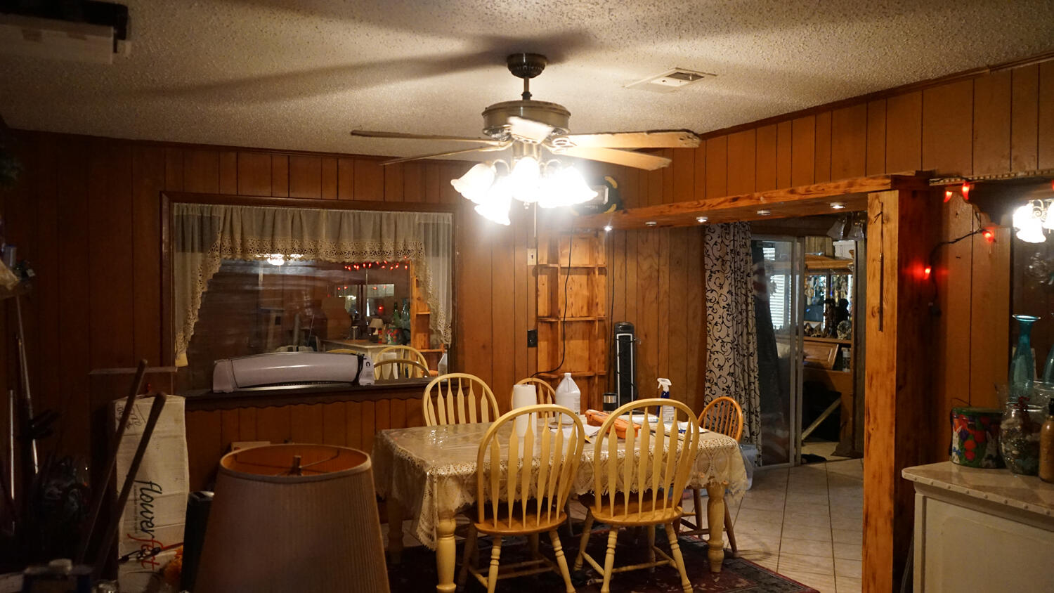 4217 Audiss Road Milton, FL 32583 - Photo 12 of 27 a view of a dining room with furniture and chandelier