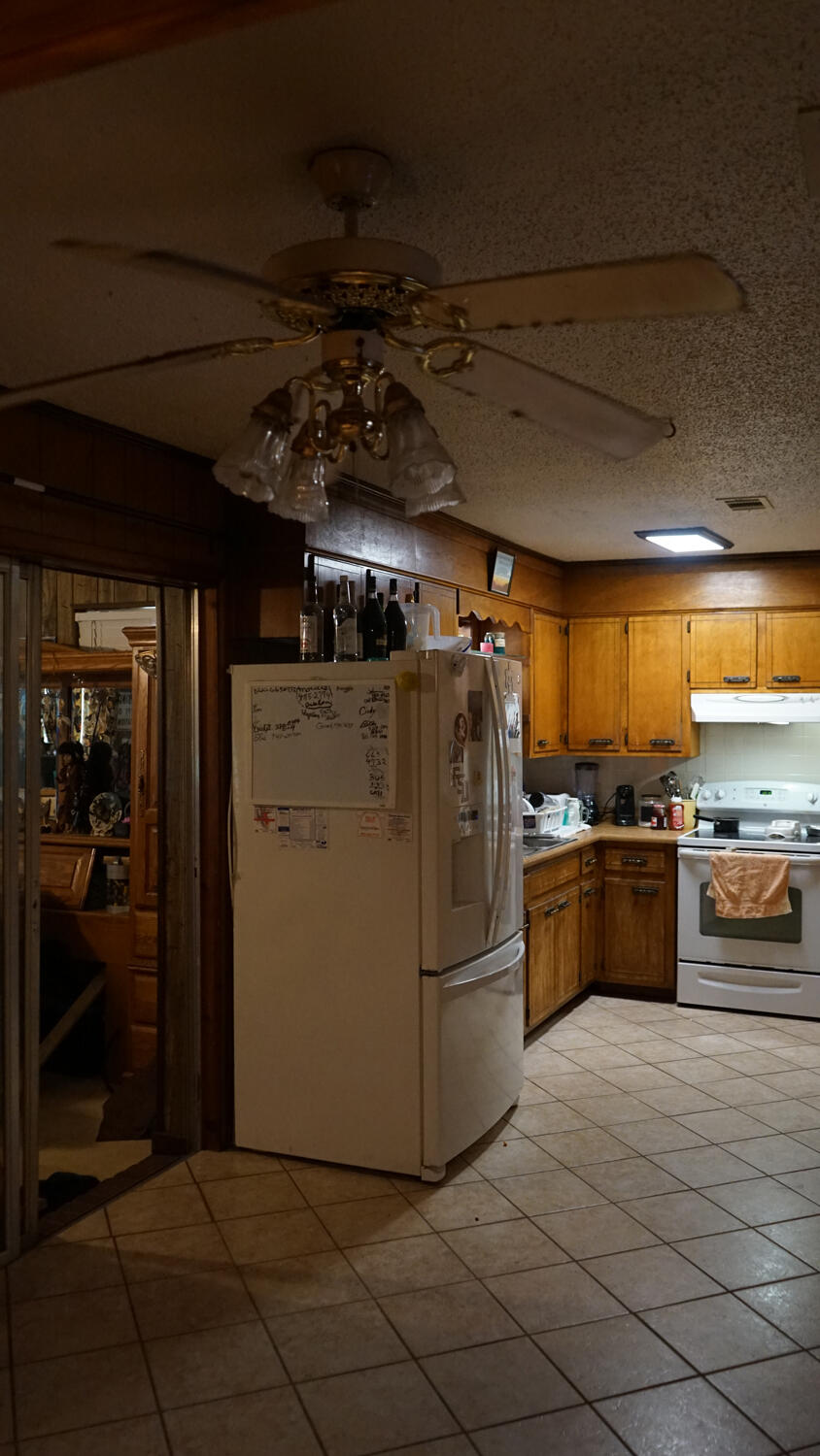4217 Audiss Road Milton, FL 32583 - Photo 15 of 27 a view of a refrigerator and a stove