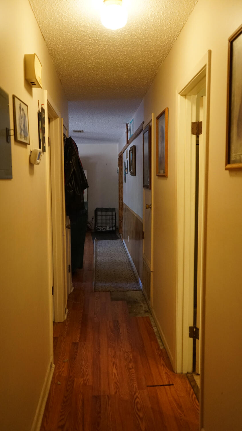 4217 Audiss Road Milton, FL 32583 - Photo 17 of 27 a view of a hallway with wooden floor