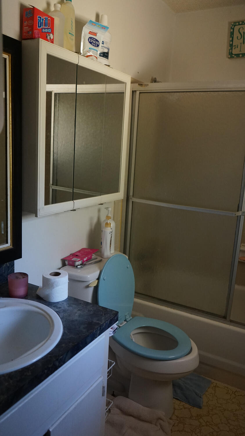 4217 Audiss Road Milton, FL 32583 - Photo 20 of 27 a bathroom with a sink toilet and shower