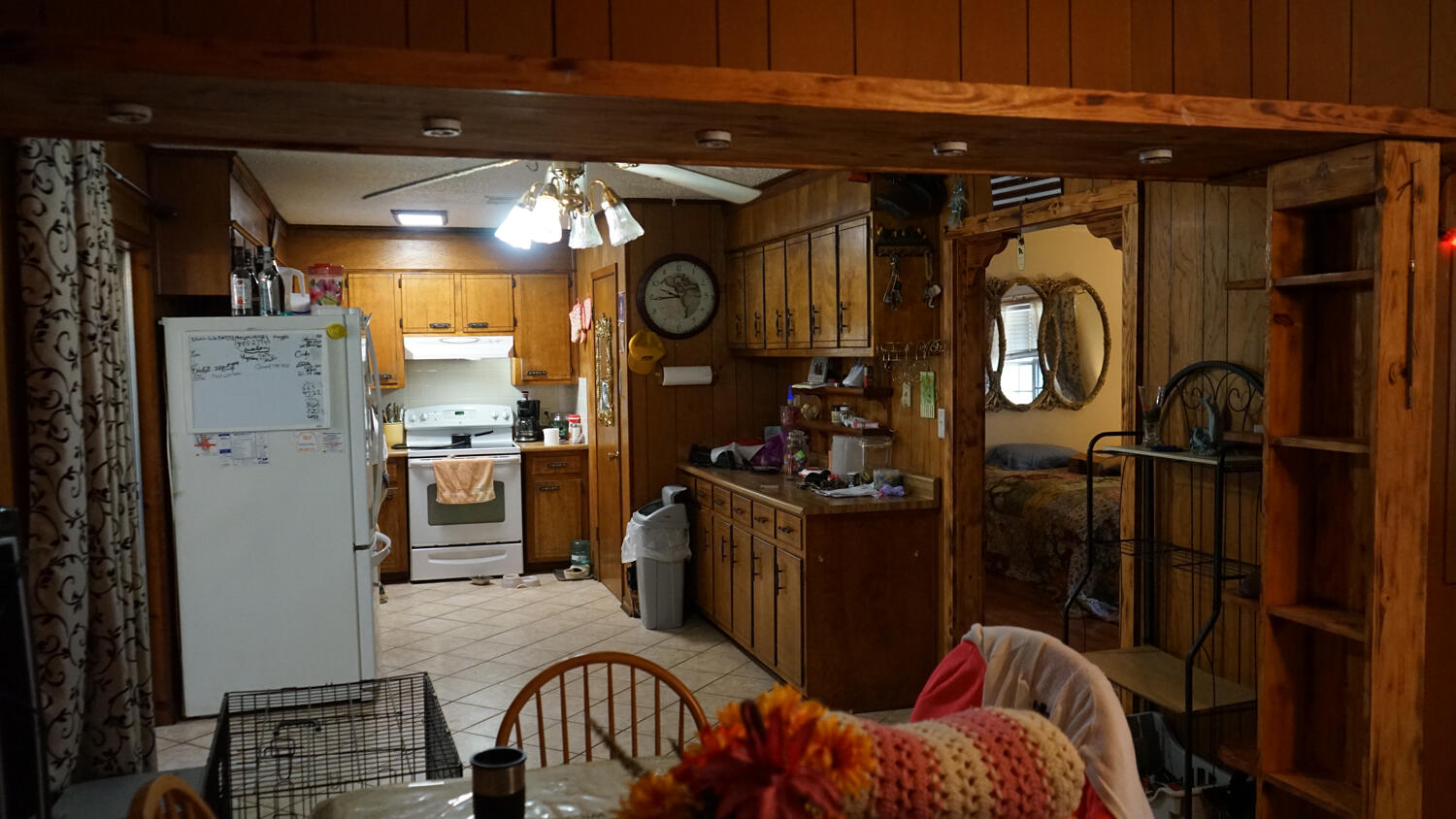 4217 Audiss Road Milton, FL 32583 - Photo 9 of 27 a kitchen with refrigerator and window