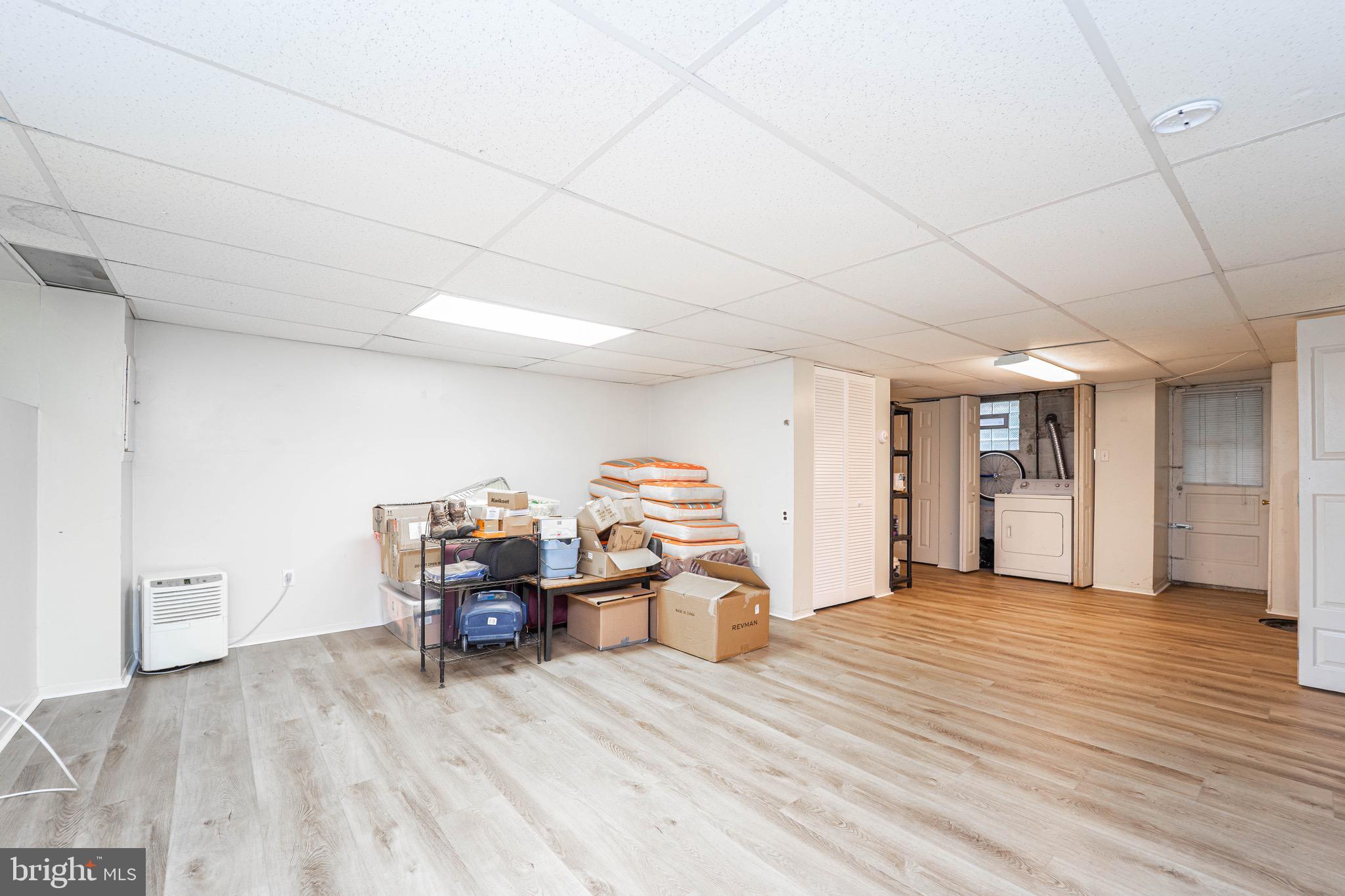 3914 Rexmere Road Baltimore, MD 21218 - Photo 25 of 29 a living room with furniture and a wooden floor