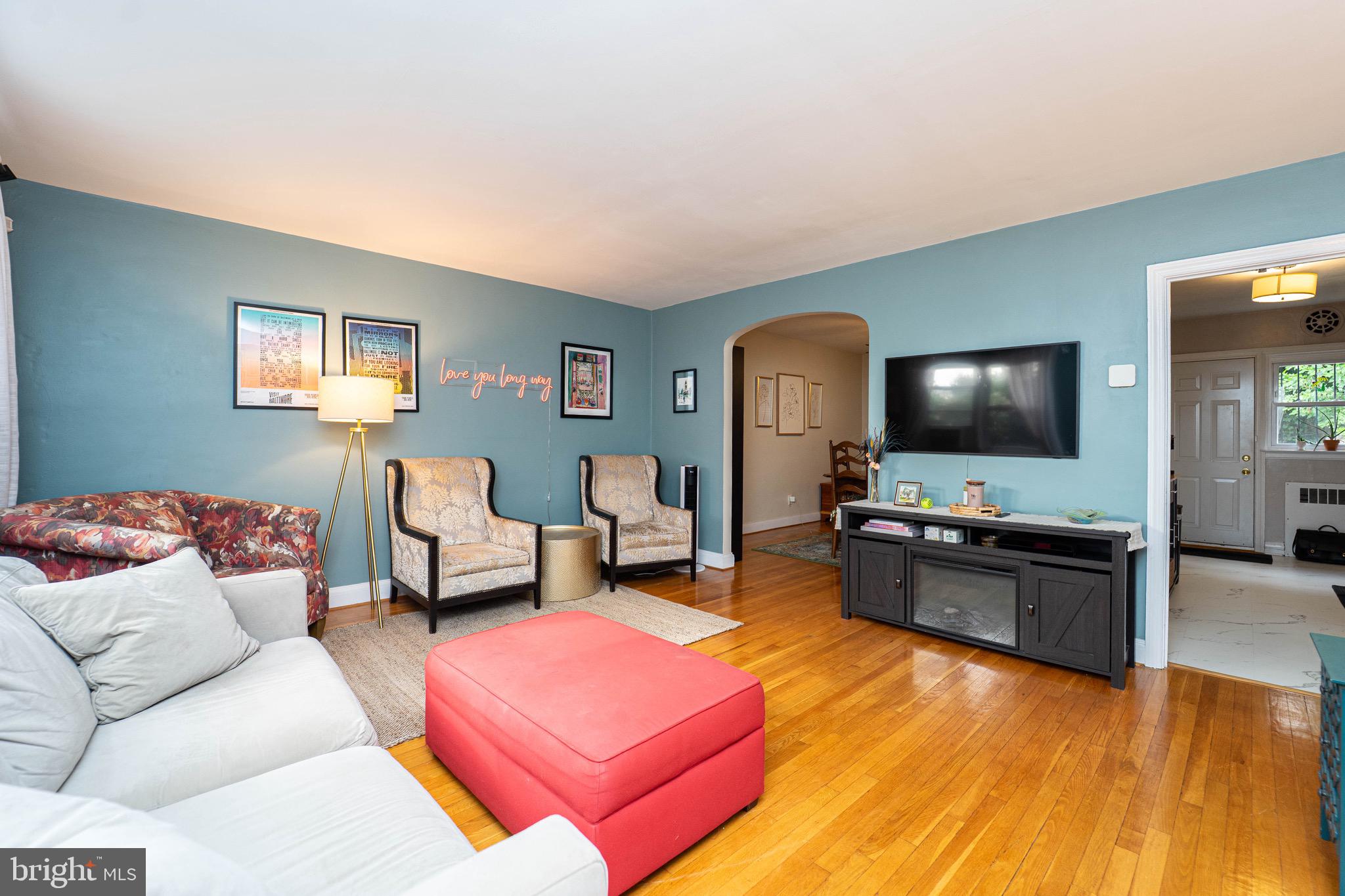 3914 Rexmere Road Baltimore, MD 21218 - Photo 3 of 29 a living room with furniture and a flat screen tv
