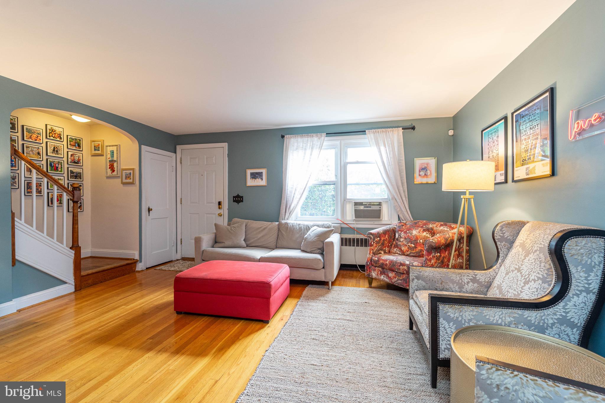 3914 Rexmere Road Baltimore, MD 21218 - Photo 5 of 29 a bedroom with furniture and wooden floor