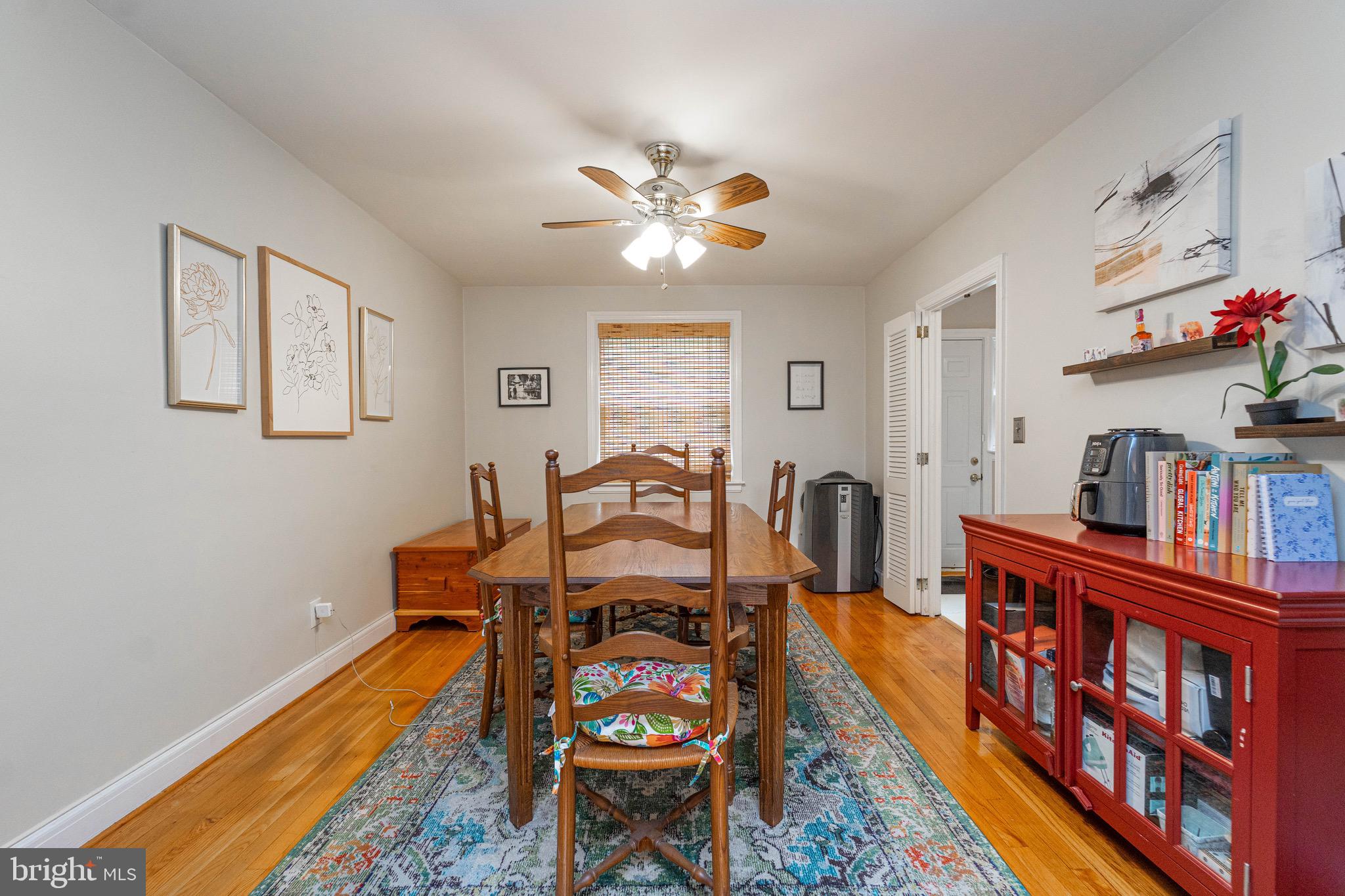 3914 Rexmere Road Baltimore, MD 21218 - Photo 7 of 29 a living room with furniture a bookshelf and a window