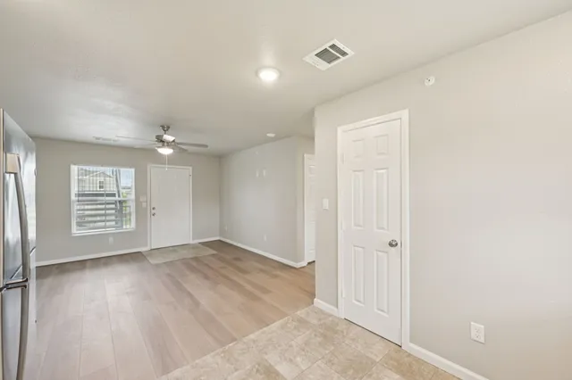a view of an empty room with a window
