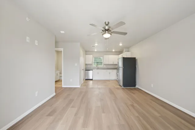 a view of a kitchen with a sink and a kitchen view