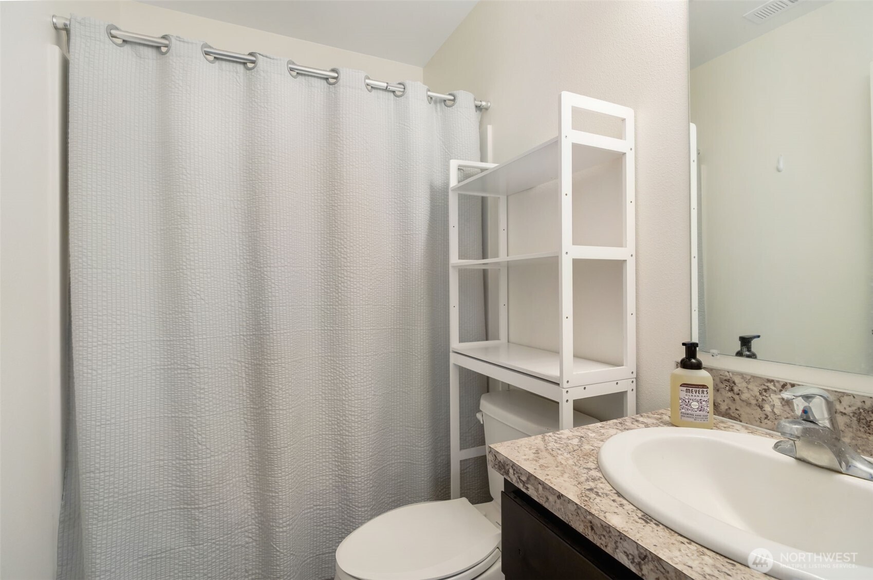 602 Cardinal Avenue Winlock, WA 98596 - Photo 6 of 24 a bathroom with a granite countertop sink toilet and shower